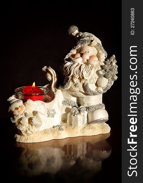 Original candlestick in the form of Santa Claus and snowman. Original candlestick in the form of Santa Claus and snowman