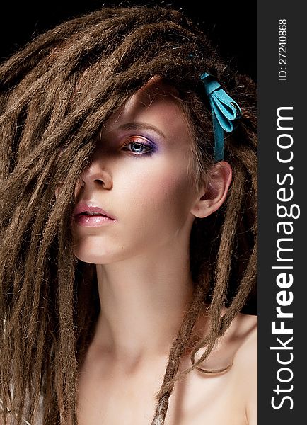 Fashion hairstyle with dreads - beautiful teen girl face. Fashion hairstyle with dreads - beautiful teen girl face