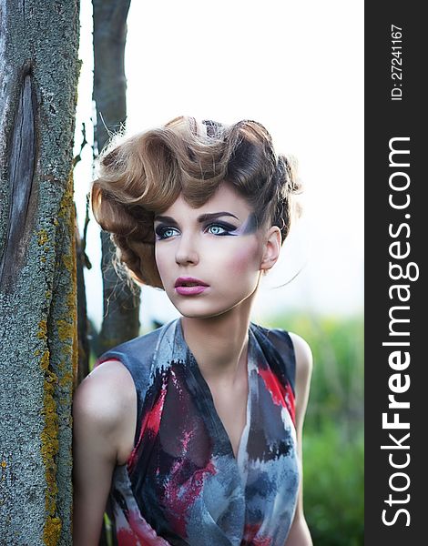 Fresh face of young beautiful sensual fashion female outdoors. Nature beauty. Fresh face of young beautiful sensual fashion female outdoors. Nature beauty