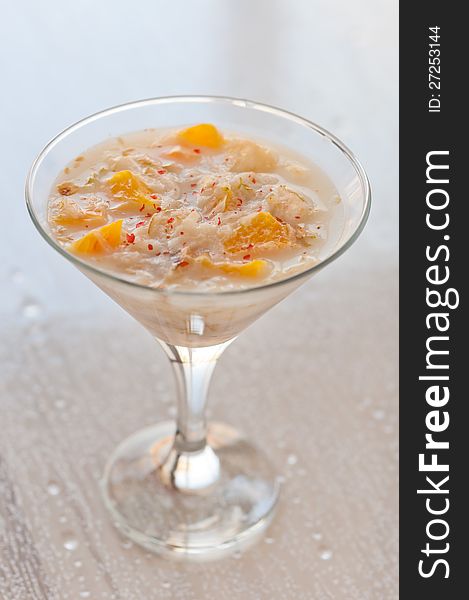 Fruit jelly in a glass goblet closeup. Fruit jelly in a glass goblet closeup