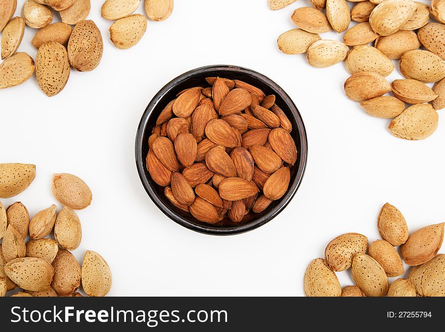Almonds in a bowl, snacks of nuts, almonds in shell