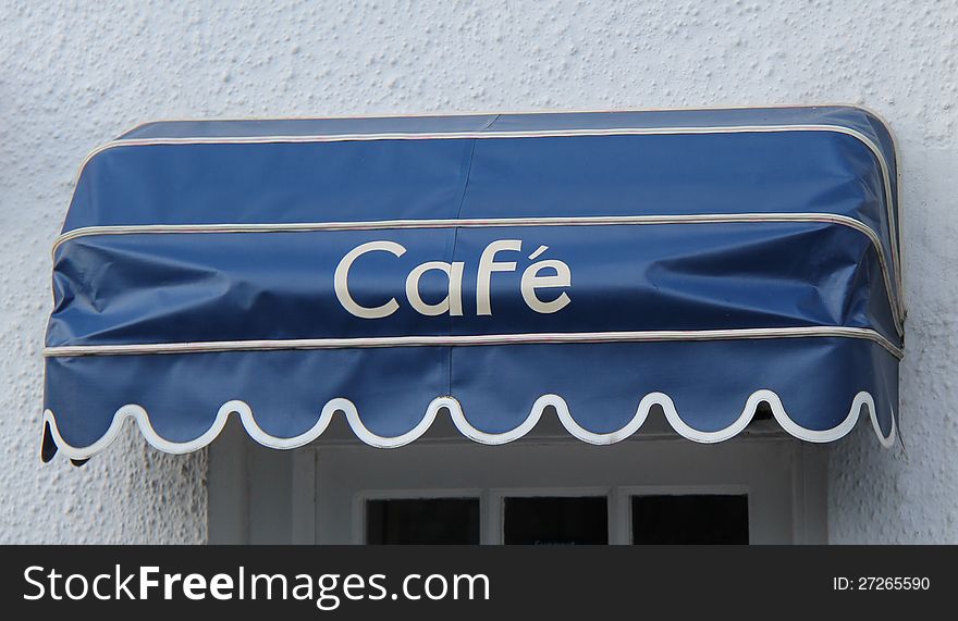 An Awning Sign Over a CafÃ© Entrance Doorway. An Awning Sign Over a CafÃ© Entrance Doorway.