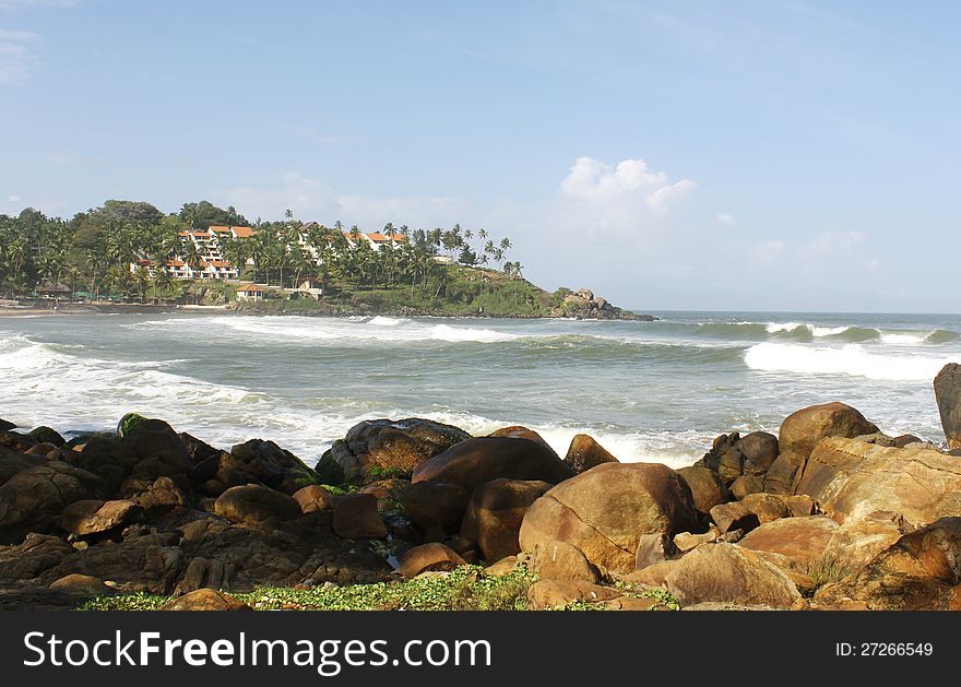 Beautiful beach surrounded by rocks in kovalam beach, india. Beautiful beach surrounded by rocks in kovalam beach, india