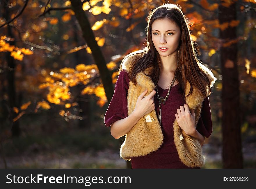 Autumn beautiful smiling girl with long hair. Autumn beautiful smiling girl with long hair