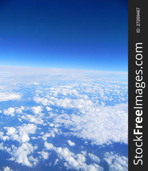 Clouds under plane, look on the Earth from atmosphere. Clouds under plane, look on the Earth from atmosphere