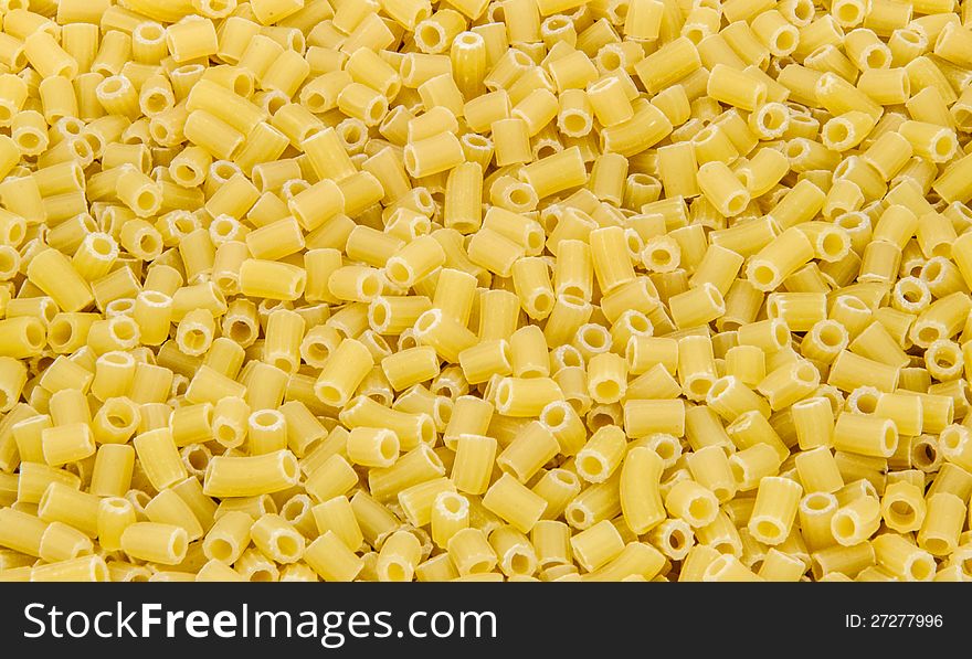 Yellow macaroni as background close up. Yellow macaroni as background close up