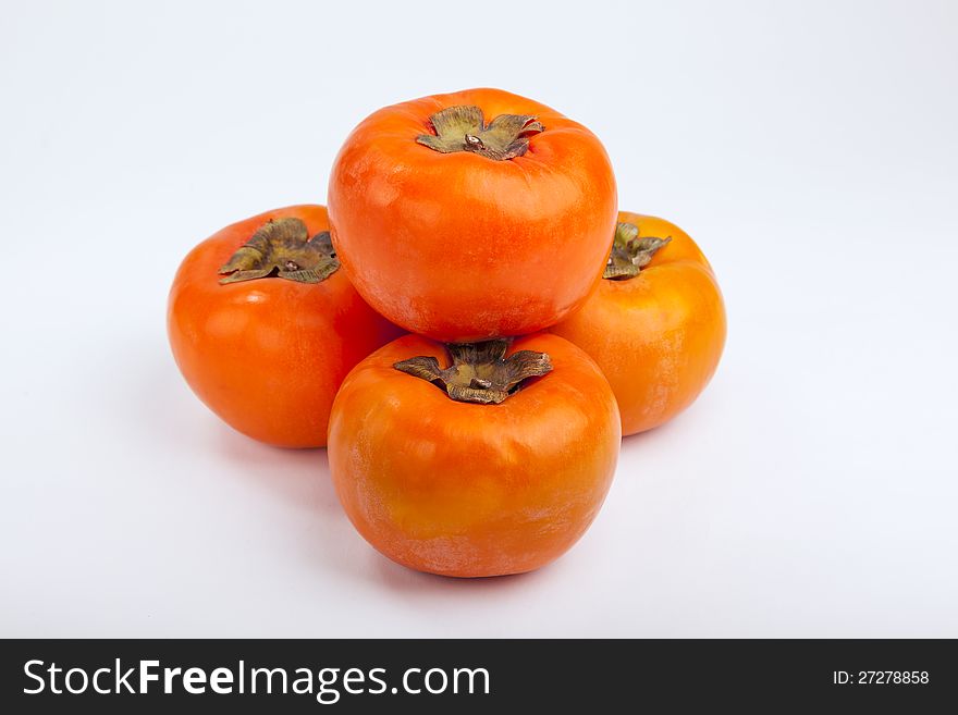 Persimmons close up, with white background