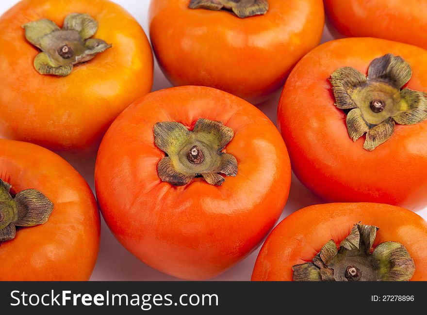 Persimmons close up, with white background