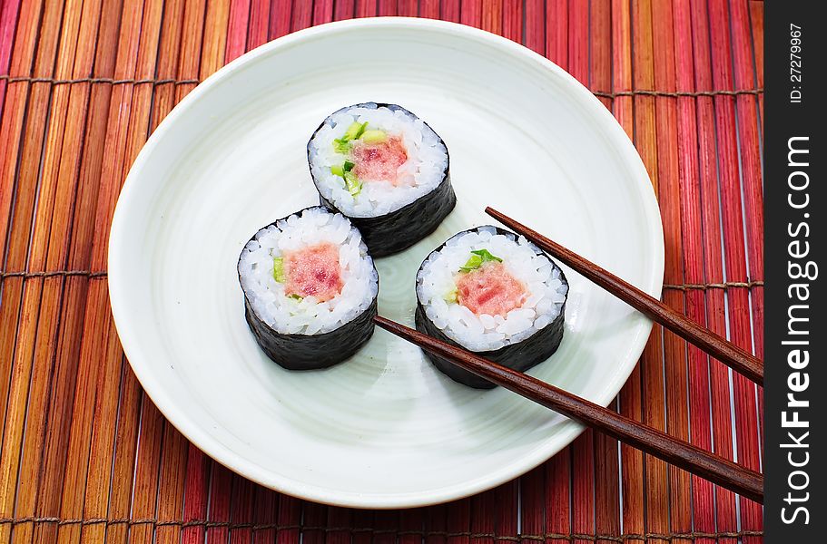 Sushi is a Japanese food consisting of cooked vinegared rice (shari) combined with other ingredients (neta), usually raw fish or other seafood. Sushi is a Japanese food consisting of cooked vinegared rice (shari) combined with other ingredients (neta), usually raw fish or other seafood.