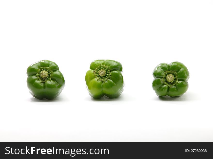 Three Green ball pepper on white background