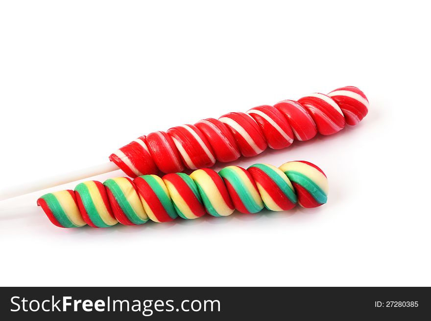 Colorful lollipops on white background.