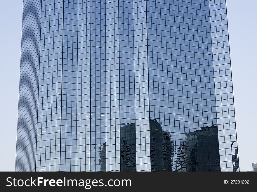 A modern business building with glass walls. A modern business building with glass walls.
