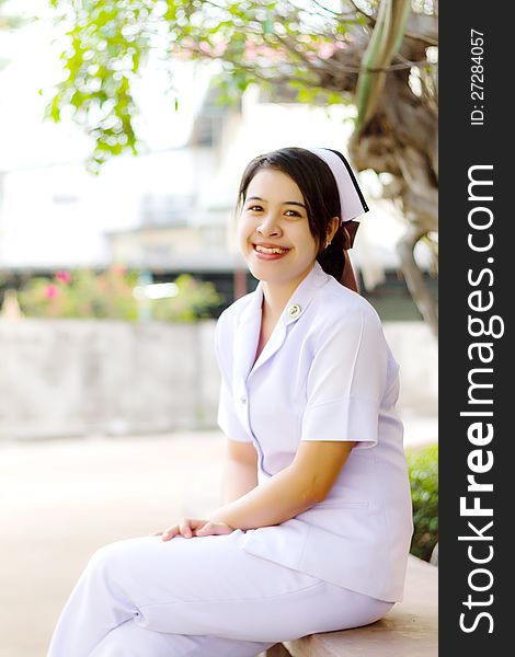 Smiling of Thai nurse in the garden