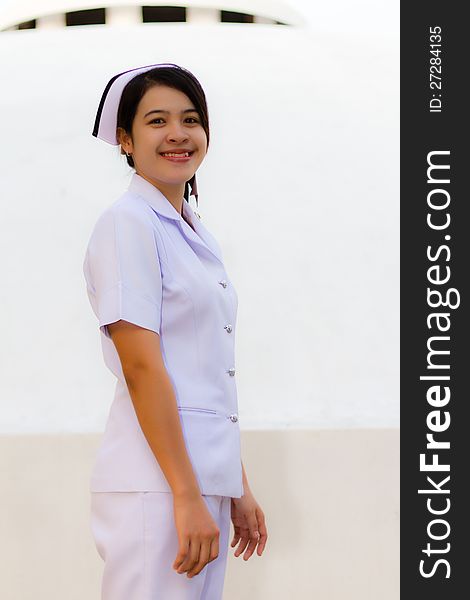 Smiling of Thai nurse on the garden