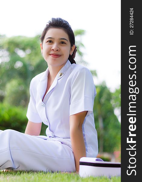 Smiling of Thai nurse on the garden