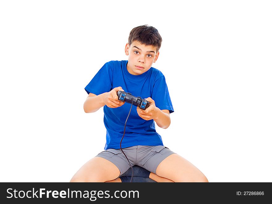 Boy playing computer games on the joystick