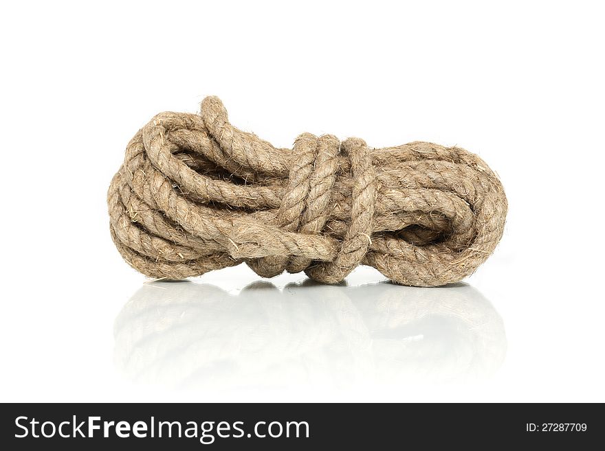 Skein of old hemp rope on white background