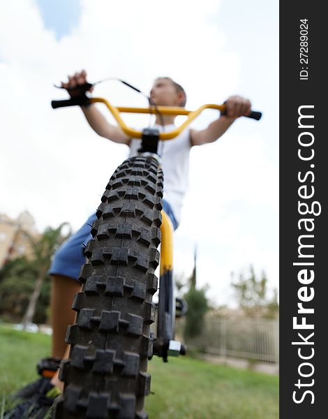 Boy On A Bicycle In The Park