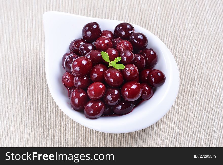 Red berries on white plate. Red berries on white plate