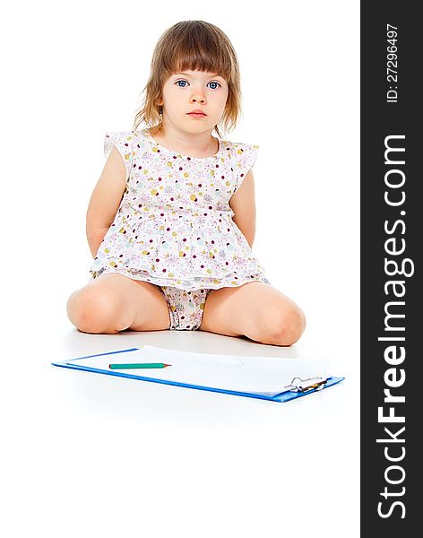 Child draws on paper on white background