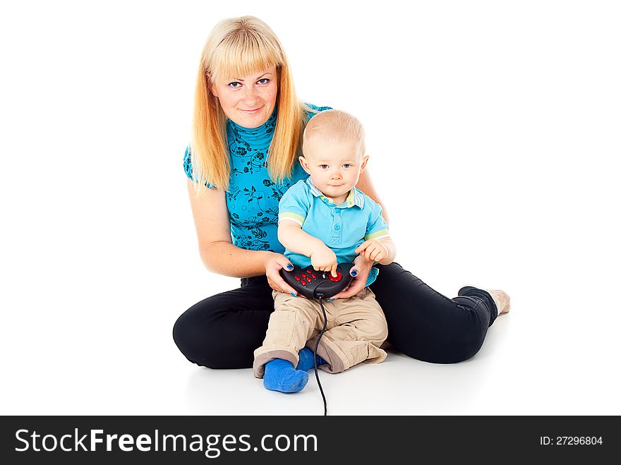 Mother with a child playing video games with a joystick