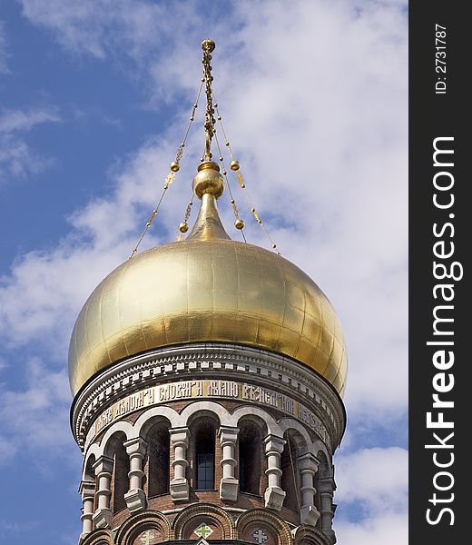 Golden tower top of a russian cathedral in St.Petersburg