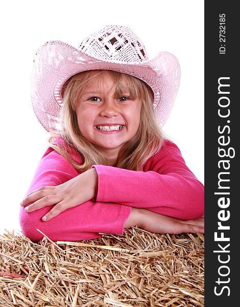 Beautiful close up portrait of a girl in a pink cowboy hat. Beautiful close up portrait of a girl in a pink cowboy hat.