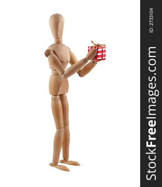 Wooden man presenting a wrapped christmas present. Isolated on white. Wooden man presenting a wrapped christmas present. Isolated on white