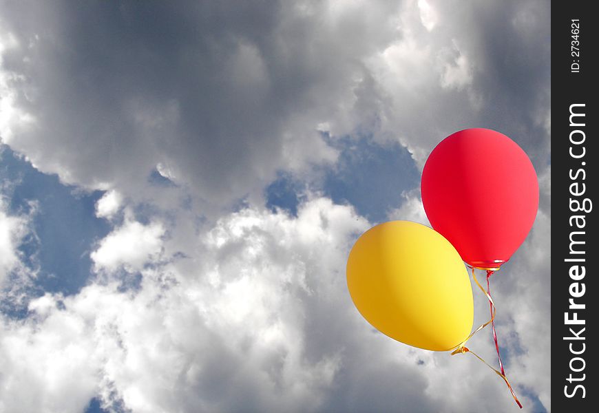 Two balloons escaping into the clouds. Two balloons escaping into the clouds
