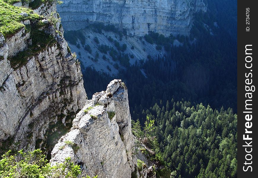 The erosion power of water and ice created this impressive natural amphitheater with vertical walls up to 160m in the Jura Mountains, a ancient mountain range near the Alps, famous for discoveries of dinosaur fossils (hence the name of the Jurassic period). It is located in Switzerland near Neuchatel city and lake. Accessible only by car or foot, a traveler can walk along its edge at an altitude little above 1400m. The erosion power of water and ice created this impressive natural amphitheater with vertical walls up to 160m in the Jura Mountains, a ancient mountain range near the Alps, famous for discoveries of dinosaur fossils (hence the name of the Jurassic period). It is located in Switzerland near Neuchatel city and lake. Accessible only by car or foot, a traveler can walk along its edge at an altitude little above 1400m.