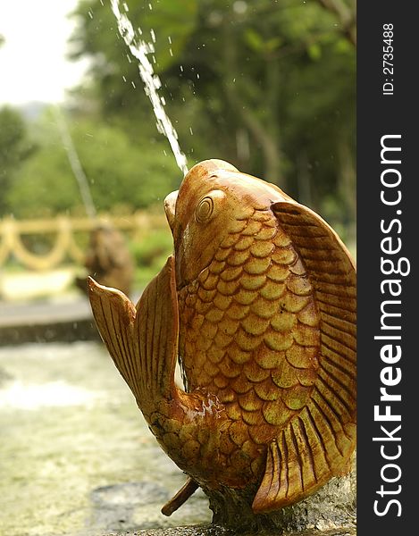 A beautiful fish water fountain on the street