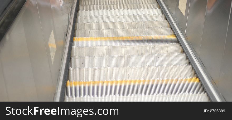 Steps on the escalator leading to the subway. Steps on the escalator leading to the subway