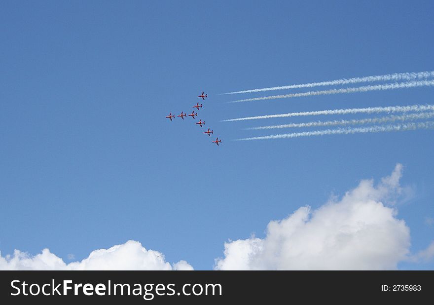 British military Hawk stunt jets in flight with smoke trails. British military Hawk stunt jets in flight with smoke trails