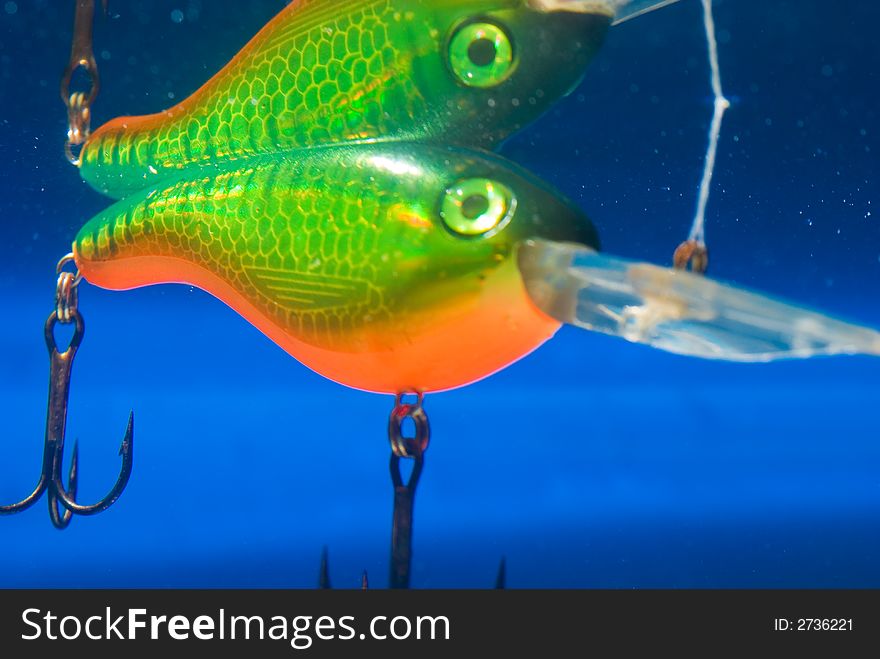 Fishing bait underwater in a blue clear water. Fishing bait underwater in a blue clear water