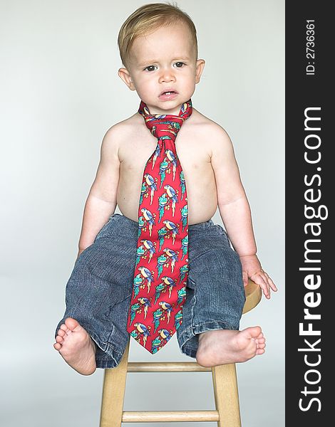 Image of cute toddler wearing jeans and a tie. Image of cute toddler wearing jeans and a tie