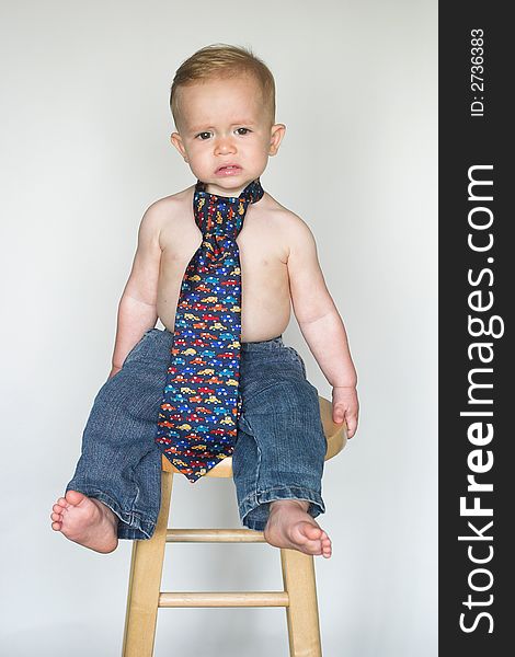 Image of cute toddler wearing jeans and a tie. Image of cute toddler wearing jeans and a tie