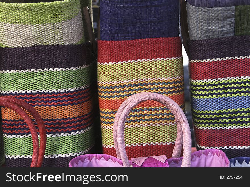 At a market in Paris woven handbags for sale