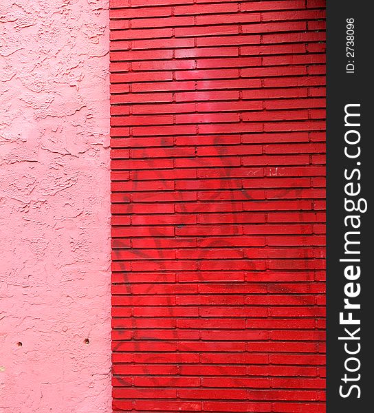 Wall of red brick and pink stucco wall for background. Wall of red brick and pink stucco wall for background