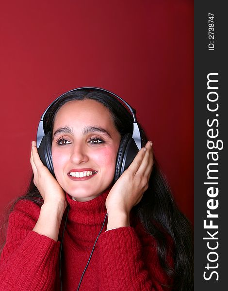 Digital photo of a woman listening music.