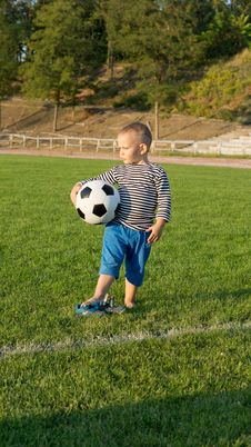 Small Boy Waiting With His Soccer Ball Stock Images