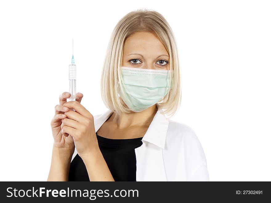 Doctor with syringe and medical mask. Doctor with syringe and medical mask