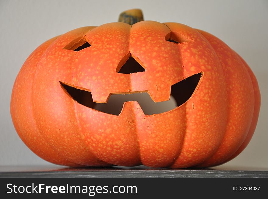 A ceramic Halloween pumpkin decoration. A ceramic Halloween pumpkin decoration