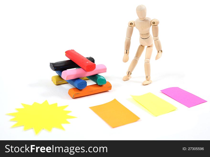 Manikin man standing next to colourfull bars. Manikin man standing next to colourfull bars.