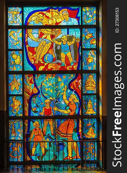 Old stained-glass window with people. Made in USSR. Old stained-glass window with people. Made in USSR