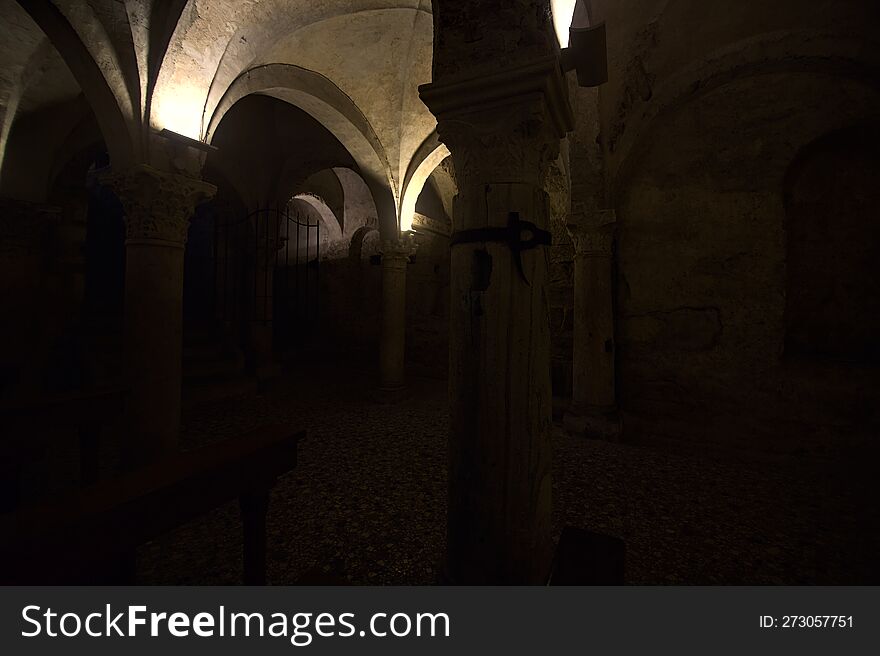 Crypt with benches and altar in the old dome of Brescia