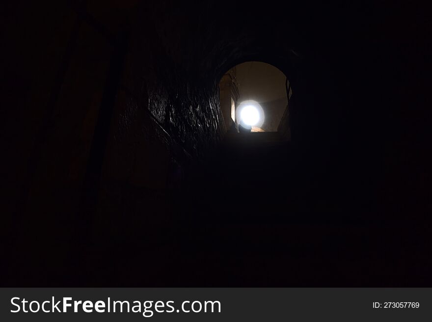 Staircase in a crypt that leads to the main nave of a church