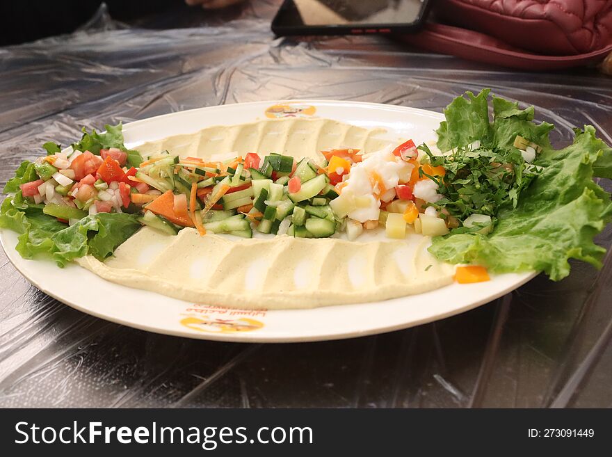 Hummus Dish With Assorted Salad