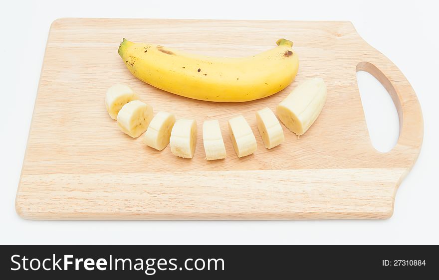 Bananas  on Wooden Chopping Board.
