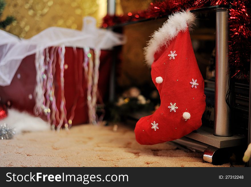 Hanging red Christmas boots with white snowflakes. Hanging red Christmas boots with white snowflakes