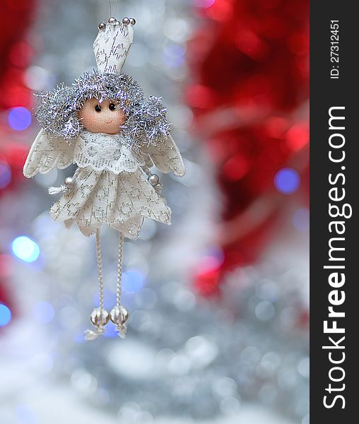 On the shiny, new year background toy handmade white angel